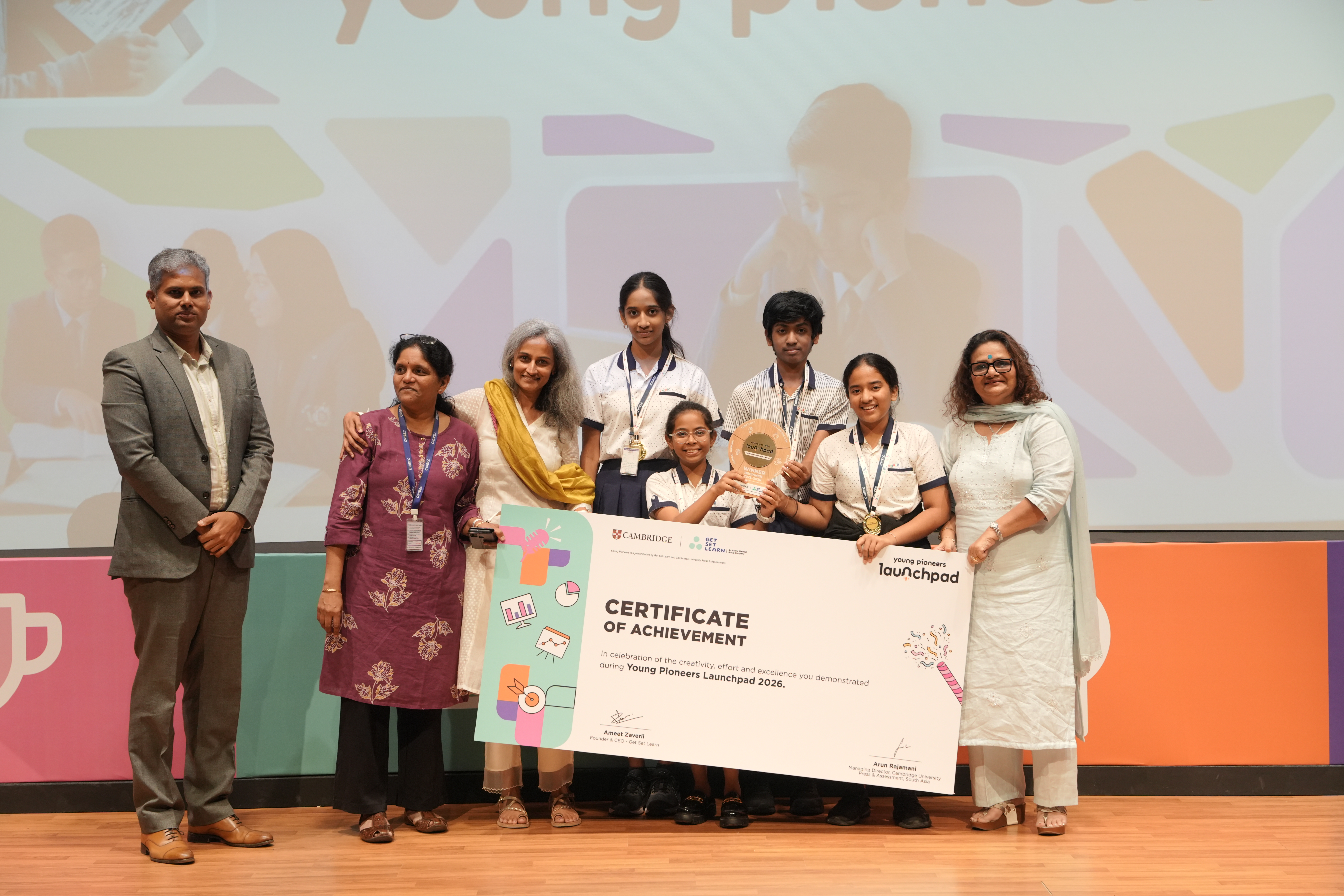The Plasmo Guard team from CHIREC International School on stage with their winner trophy and certificate